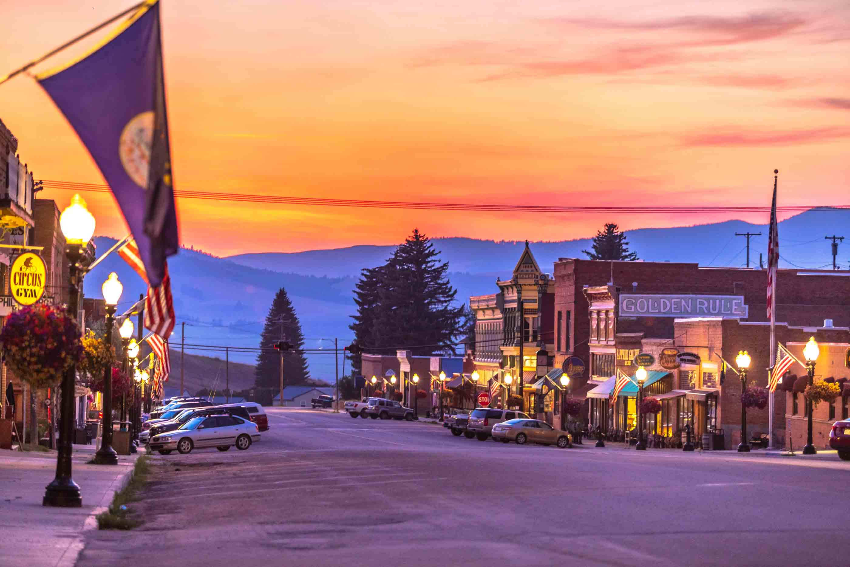 Street view of Broadway Street in Philipsburg, Montana during a stunning sunset.